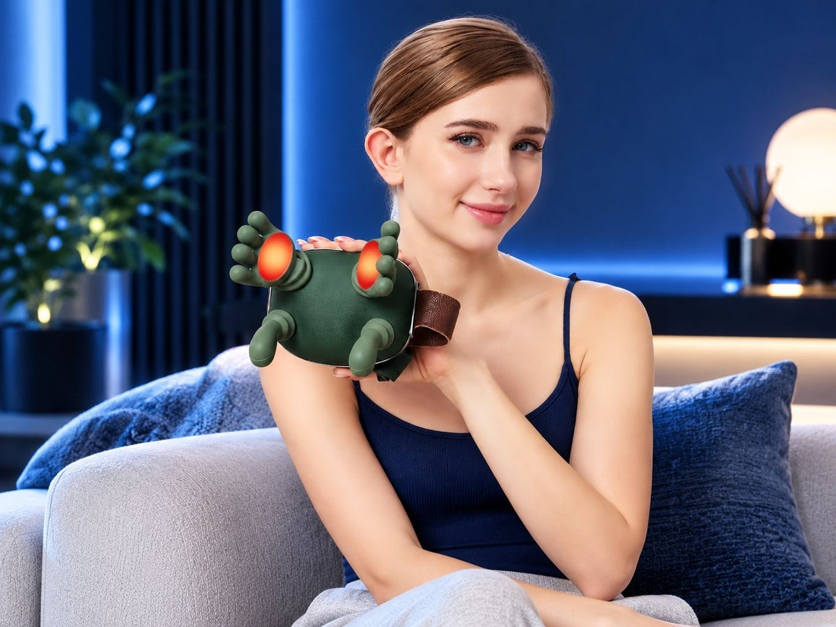 Woman holding the green TheraNeck Pro neck and shoulder massager with illuminated heated massage heads.